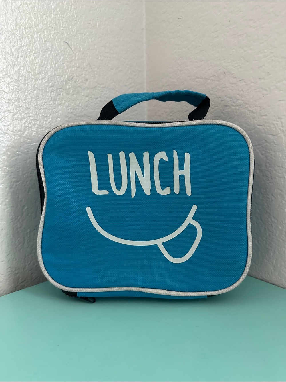 Walmart blue insulated lunch box with a minimalist white ’LUNCH’ graphic-used
